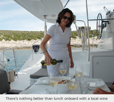 sailing in the ionian sea, enjoying local Greek wine